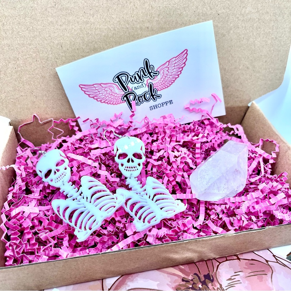 Skeleton earrings paired with a crystal rock 💎💀Punk Rock 💕